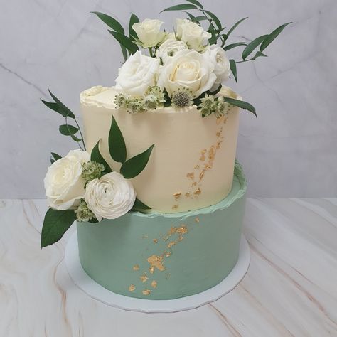 Cream and Sage Green Wedding Cake with Buttercream finish, two tier, gold leaf, fresh flowers wedding cake Two Tier Wedding Cake Sage Green, Two Tier 75th Birthday Cake, Two Tier Sage Green Cake, Save Green Wedding Cake, Sage Green Birthday Cake 2 Tier, Two Tier Green Cake, Sage Green Cake Wedding, Sage Green And Gold Birthday Cake, Sage Green Wedding Cake Ideas