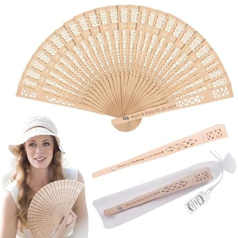 PRICES MAY VARY. Wedding Fans: This classic style sandalwood fan not only represents feminine elegance but also keeps you cool in the summer and decorates your home and office. Used as a wedding fan, it will have a fresh and elegant feel. Personalized Wedding Favors: These fans are made from sandalwood, a hardwood with a natural aroma that is perfect for abanicos de mano. Packaging contents: 50 packs of sandalwood fans, 50 organza bags. abanicos de mano personalizados: lightweight and foldable, Wedding Fans For Guests, Personalized Wedding Fans, Aspen Lodge, Wedding Fan, Folding Fans, Table Fans, Welcome Table, Folded Hands, Feminine Elegance