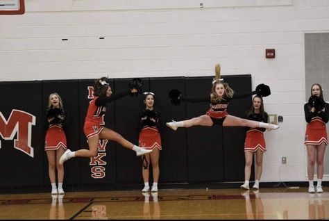 a cheerleader on the left does a hurdler while a cheerleader on the right does a toe touch Toe Touches, Cheerleading, Basketball Court, Turn Ons