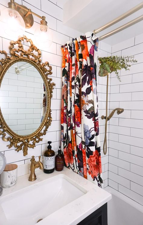 Eclectic Boho Colorful Small Bathroom | Gold Antique Mirror and Fixtures | Bold Floral Shower Curtain | Floor to Ceiling White Subway Tile | Eucalyptus Shower Head Colorful Small Bathroom, Vintage Gold Mirror, Black White Bathrooms, Bathroom Decor Apartment, Bedroom Renovation, Floral Shower Curtains, Apartment Bathroom, Farmhouse Bathroom Decor, Chic Bedroom