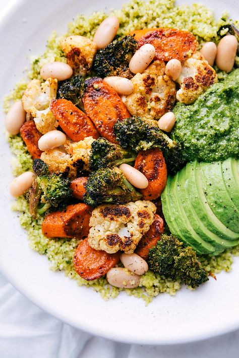 Perfectly roasted cauliflower, broccoli, and carrots atop a bed of easy (5-minute) pesto couscous. This easy vegetarian meal is packed with flavor, protein, and healthy fats. This is a must try! Pesto Couscous, Pesto Bowl, Vegetarian Pesto, Vegetable Bowls, Chelsea's Messy Apron, Roasted Brussel, Vegetarian Meal, Veggie Bowl, Veggie Tray