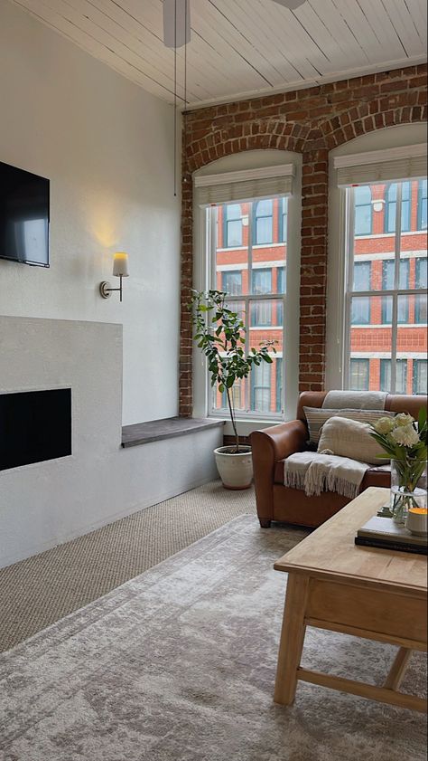 Brick Loft Apartment. Fireplace with storange benches. DIY Project.
Cozy and modern. Sconces beside fireplace. Indoor citris tree. Apartment Exposed Brick, Apartment Decor Brick Wall, Brooklyn Fireplace, Exposed Brick Wall Apartment, Exposed Brick Condo, Exposed Brick Walls Living Room Modern, Living Room Exposed Brick, Brick Living Room Decor, Red Brick Apartment