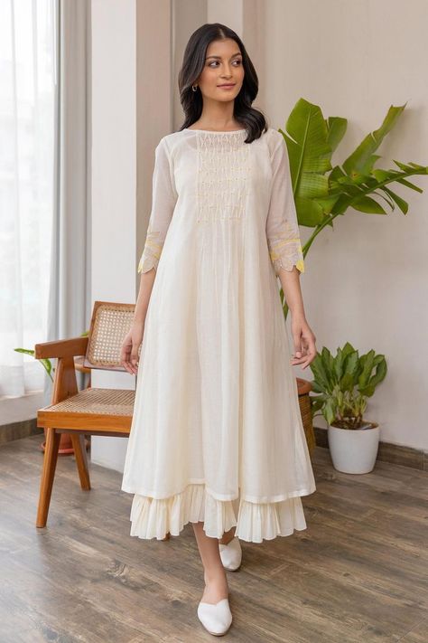 Buy off-white #chanderi #dress with smock pattern on yoke & yellow applique embroidered #floral motifs on sleeve at #AzaFashions Shop online now at #Azafashions.com Call +91 8291990059 or email contactus@azafashions.com for enquiries. #wedding #festive #ethnic #tradional #shopping #shoponline #party डिजाइनर कपड़े, Simple Frock Design, Casual Frocks, Simple Frocks, Anarkali Dress Pattern, Simple Kurta Designs, Simple Kurti Designs, Frock For Women, Long Dress Design