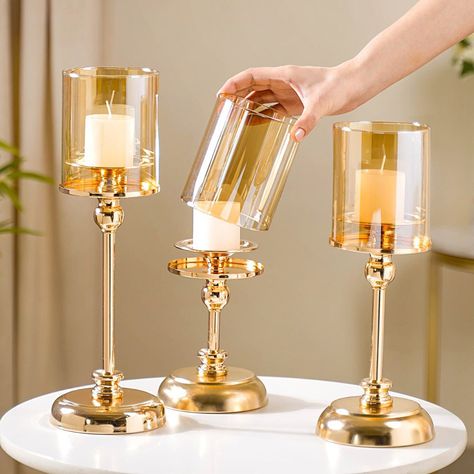 Ready, set, glow! 🕯️✨ Infuse your home with the opulent warmth of our chic candle stands! 🛍️💖 Products included: 1. Decor Votive Candle Holder Set Of 3 2. Emerald Decorative Candle Holder Set Of 2 3. ⁠⁠Lavish Crystal Hurricane Candle Holder Set Of 2 4. ⁠Marble Vintage Candle Holders Set Of 2 5. ⁠Set Of 2 Luxury Pillar Candle Holder 6. Tall Luxury Floor Candle Holder Set Of 3 7. Crystal Luxury Candle Stand Set Of 2 8. ⁠⁠⁠Golden Tall Floor Candle Stand Set Of 3 Large 9. ⁠Hurricane Metal Cand... Gold Pillar Candles, Metal Candle Stand, Chic Candles, Floor Candle Holders, Candle Stands, Floor Candle, Metal Candle Holder, Luxurious Aesthetic, Luxury Floor