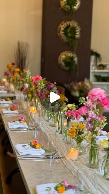 Une Table By Tania | NYC Picnics, tablescapes & flowers on Instagram: "A Baby in Bloom Shower!

*venue: @terravitanj

#babyinbloom #babysprinkle #babyshower #budvases #wildflowers #wildflowertheme #flowers #florals #wildflowergarden #babyshowerideas #babyinbloombabyshower #loveinbloom #flowerrunner" Wildflower Baby Shower Theme Table Decor, Baby In Bloom Table Setting, Baby In Bloom Table Decor, Wildflower Baby Shower Decorations, Flower Runner, Bday Dinner, Wildflower Baby Shower, Baby In Bloom, Flowers Instagram