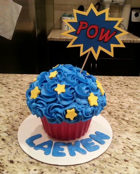 Superhero giant cupcake smash cake Giant Cupcake Smash Cake, Cupcake Smash Cake, Huge Cupcake, Joey Birthday, Baby First Cake, First Cake Smash, Cupcake Smash Cakes, Superman Birthday Party, Superman Cakes