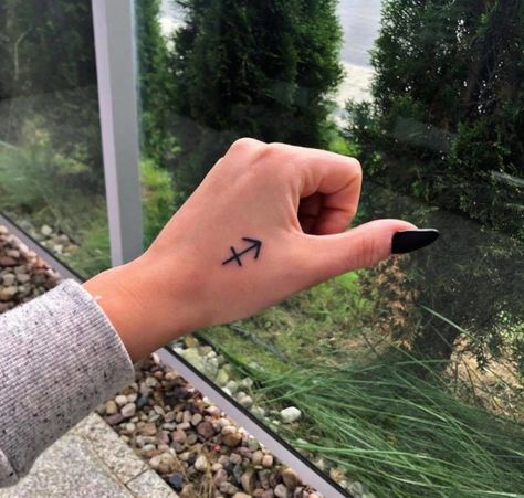 Small Sagittarius Tattoo Simple, Siggatarus Zodiac Tattoo, Sagittarius Tattoo Wrist, Small Saggitarius Tattoos, Zodiac Signs Tattoos Sagittarius, Sagittarius Tattoo Designs For Women Small, Sagittarius Finger Tattoo, Fine Line Sagittarius Tattoo, Sagittarius Hand Tattoo