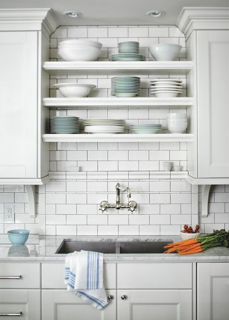 undermount sink with antique faucet. subway tile backsplash. open shelves between cabinets. Kitchen Sink Wall No Window, Kitchen Sink With No Window, Sink With No Window, Kitchen Sink Wall, White Subway Tile Kitchen, Over Kitchen Sink, Above Kitchen Sink, Kitchen Sink Decor, Kitchen Sink Window