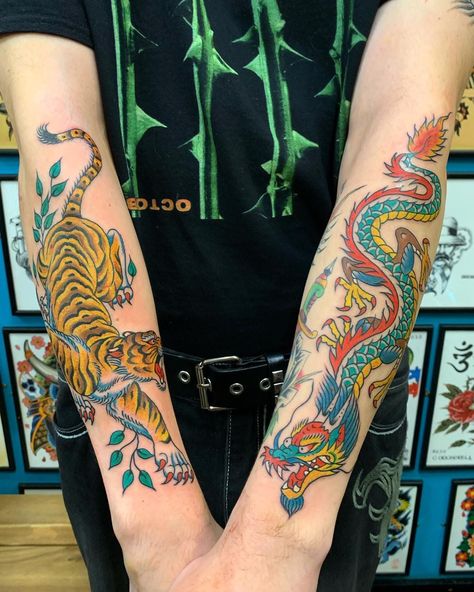 ⚡️ Double trouble ⚡️ Both Tiger and Dragon forearm tattoos in one day Bernard Kwok in the studio every Thursday to Saturday, knocking it out the park with these 2 immense pieces ! Call to book in or drop by to check out available designs for inspo Tiger Vs Dragon Tattoo, Eastern Dragon Tattoo, Color Forearm Tattoo, Old School Dragon Tattoo, Forearm Dragon Tattoo, American Traditional Dragon Tattoo, Tiger Dragon Tattoo, Traditional Dragon Tattoo, Dragon Tattoo Forearm