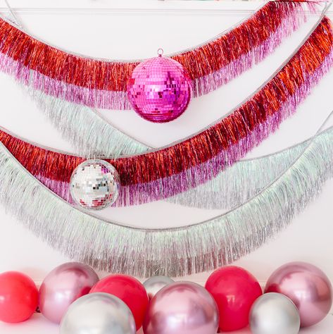 Pink, red and iridescent tinsel fringe makes the perfect Photo Booth backdrop for your disco themed party or event. Layer it on top of each other for a fuller effect. Would be fabulous for NYE or a birthday party set up! New Years Eve Party Decor, Photo Backdrop Ideas, Backdrop Fringe, Party Fringe, Roller Skate Birthday Party, Disco Theme Party, Valentines Brunch, Cocktail Party Decor, Disco Theme