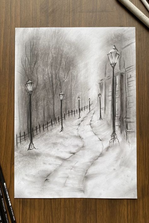 A pencil sketch of a winter evening park scene with lampposts lining a snow-covered path, leading past bare trees and a cottage. Christmas Drawings Aesthetic, Winter Season Drawing, Park Sketch, Winter Sketch, Barn Drawing, Winter Drawing, Mountain Sketch, Soldier Drawing, Beauty Of Winter