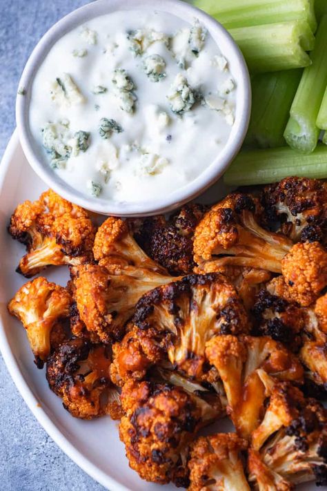 Easy buffalo cauliflower air fryer recipe! These small cauliflower bites with buffalo sauce are a fun and easy appetizer or snack made with simple ingredients. Coat the cauliflower florets with buffalo sauce flavor, and air fry them to perfection! Buffalo Cauliflower Air Fryer Easy, Buffalo Cauliflower Air Fryer, Easy Buffalo Cauliflower, Cauliflower Air Fryer, Buffalo Bites, Buffalo Cauliflower Recipes, Buffalo Cauliflower Bites, Air Fryer Recipe, Buffalo Cauliflower