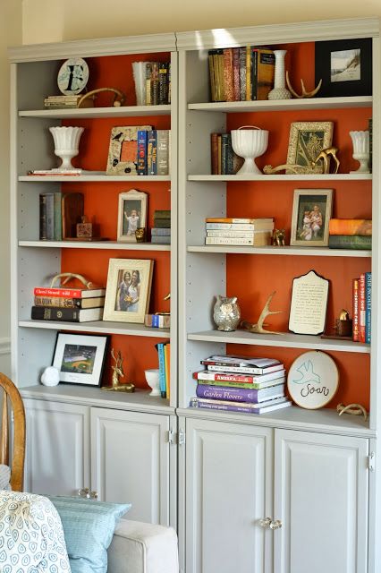 Probably wouldn't do the orange, but would be a cool way to add a pop of color to the living room! Bright Color Bookshelf, Orange Bookshelves, Vintage Home Decor Eclectic, Bold Background, Home Decor Eclectic, Wall Shelves Bedroom, Built In Shelves Living Room, Modern Wall Shelf, Fall Home Tour