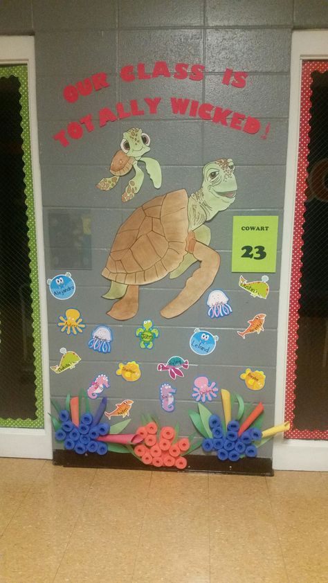 Finding Dory classroom door. "Our classroom is totally wicked!" Disney Door Decorations Classroom, Disney Door Decorations, Turtle Classroom, Finding Nemo Theme, Teacher Door Decorations, Beach Theme Classroom, Disney Themed Classroom, Ocean Classroom, Turtle Theme