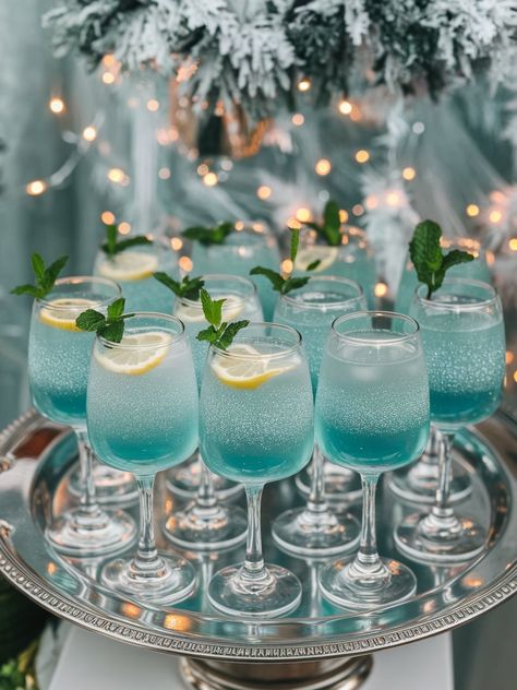 melts. Navy Blue Drinks, Jack Frost Themed Food, Winter Wonderland Mimosa, Winter Wonderland Mock Tails, Blue Colored Appetizers, Icy Party Theme, Boy Baby Shower Tea Party, Blue Holiday Drinks, Drinks For Baby Shower Boy