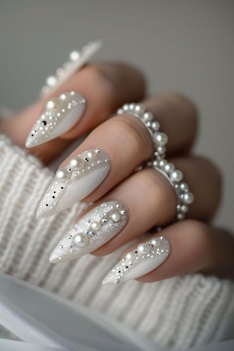 Enhance your nails with beautiful pearl embellishments. Follow us for more fun nail art ideas. Check out our blog on the bride’s ultimate guide to perfect wedding nails. Minimalist Nails | Elegant Nails | Nails 2024 Summer | Nails Design Summer | Nails With Charms | Nails Easy | Wedding Day Nails | Simple Summer Nails | Nails Elegant Classy | Almond Nails | Elegant Touch Nails | Trendy Nails | White Nails | Nails Design With Rhinestones | Nails Summer 2024 | Nails Inspo 2024 | Nails Design White Winter Nails, Embellished Nails, Elegant Touch Nails, Wedding Day Nails, Pearl Nail Art, Fashion Nail Art, Nails Elegant, Bridal Nail Art, Fancy Nails Designs