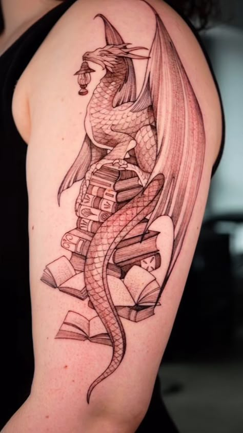 Dragon And Book Tattoo Ideas, Bookish Dragon Tattoo, Dragon Books Tattoo, Book Dragon Tattoo For Women, Book Tattoo With Dragon, Inkheart Tattoos, Dragon On Books Tattoo, Dragon And Books Tattoo, Dragon With Books Tattoo