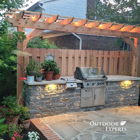 Stone Patio With Outdoor Kitchen, Outdoor Stone Kitchen Ideas, Outdoor Kitchen Along Fence, Side Yard Outdoor Kitchen, Back Patio Grilling Area, Pergola Grilling Area, Stone Grill Outdoor, Outdoor Kitchen Patio Design, Back Yard Bbq Ideas Grill Area Patio