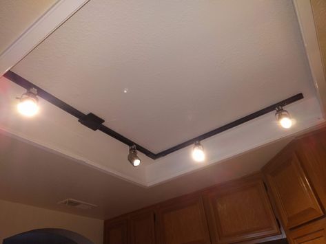 How to Replace Fluorescent Kitchen Lights With a Track Light Fixture Track Lighting Living Room, Fluorescent Kitchen Lights, Fluorescent Light Fixture, Modern Kitchen Lighting, Track Lighting Fixtures, Kitchen Lights, Track Light, Kitchen Ceiling, Kitchen Lighting Fixtures