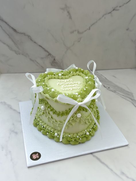 Sage green vintage heart cake with white bows and pearls Sage Green And White Birthday Party, Green Heart Birthday Cake, Green Cakes Ideas, Smiski Cake, Light Green Birthday Cake, Love Heart Cakes, Green Sweet 16 Cake, Vintage Birthday Ideas, Sage Green Cake Ideas