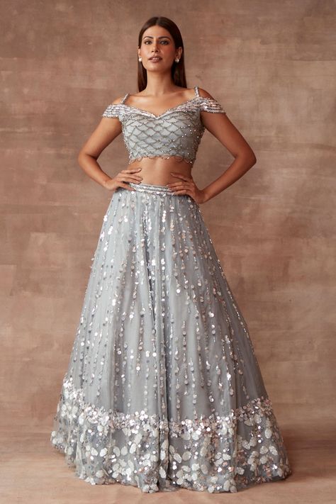 Silver grey lehenga with all-over sequin embroidery. Comes with cold shoulder blouse. Component: 2 Pattern: Embroidery Type Of Work: Sequin and Cutdana Neckline: Cold Shoulder Fabric: Organza Color: Grey Other Details:  Shoulder straps Scalloped trim embroidery on the blouse Occasion: Bride - Aza Fashions Latest Crop Top Designs For Lehenga, Ruffle Blouse Designs, Grey Lehenga, Desi Fits, Organza Lehenga, Neeta Lulla, Indian Outfits Lehenga, Blue Organza, Lehenga Designs Simple