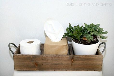 Modern Farmhouse Bathroom Decor via designdininganddiapers.com Bathroom Toilet Top Decor, How To Decorate Top Of Toilet Tank, Basket On Top Of Toilet, Basket On Toilet Tank, Top Of Toilet Tank Decor Ideas, Toilet Basket Ideas, Toilet Tank Decor Ideas, Toilet Organization, Toilet Tank Basket