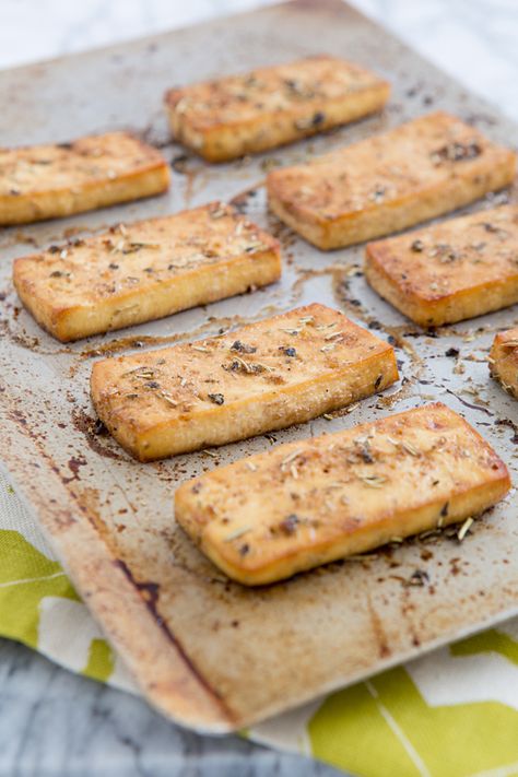 baked italian herb tofu2 tablespoons liquid aminos (I used coconut aminos) 1 tablespoon light olive oil 1 tablespoon water 1 teaspoon red wine vinegar 1 1/2 teaspoons garlic powder 1/2 teaspoon dried basil 1/2 teaspoon dried rosemary 1/2 teaspoon dried oregano A dash of freshly ground black pepper 1 (15-ounce) package extra-firm tofu, pressed for 30 minutes and cut into 8 slabs Salt to taste Tofu Recipes Baked, Press Tofu, How To Press Tofu, Meatless Recipes, Marinated Tofu, Tofu Dishes, Baked Tofu, Vegan Meal, Think Food