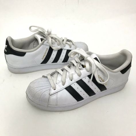 Brand: adidas Size: Men's 6.5 Color: White with black stripes Style: Superstar classic lace up sneaker Material: Leather upper Condition: This item is in gently worn pre-owned condition with some marking to upper. Chunky Adidas Sneakers, Adidas Superstar Men, Masc Clothing, Adidas Classic Shoes, Superstar Adidas, Black Superstar, Adidas Shoes Mens, Striped Sneakers, Adidas Originals Superstar