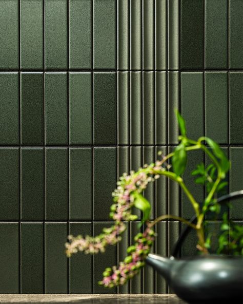 We have released Special Editions 10 on our website. Theme is ""Connect naturally"". Living room and Kitchen, two spaces for family connected with green tiles. First, we will show you the kitchen. It was based on YOROI and used YUKASUMI as an accent. The vertical lines are impressive. more information, please visit our website inaxtile.com #japanese_tile_world#jtw#inaxjapan#madeinjapan#japan#inaxtile#ceramics#tiles#YOROI#YUKASUMI#connect#bathroomideas#bathroomtiles#kitchenideas#kitchenbacks... Japanese Tile, Modern Japanese Interior, Ceramics Tiles, Green Tiles, Dark Countertops, Aesthetic Sense, Living Room And Kitchen, Traditional Pottery, Tiles Design