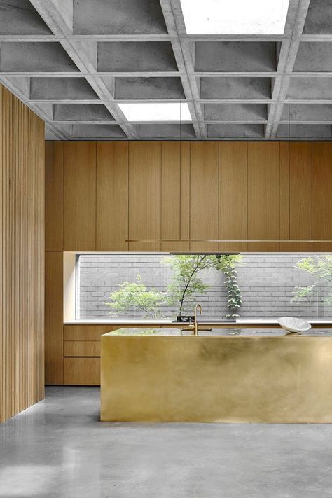 brass island bench in kitchen with polished concrete floor, coffed ceiling and timber joinery Waffle Ceiling, Est Living, Island Bench, Boundary Walls, Waffle House, Garden Architecture, Traditional Garden, Linear Lighting, Keno