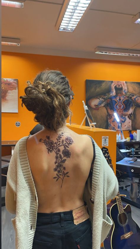 A girl with a big floral tattoo on her back. The picture was taken in the tattoo studio Floral Back Tattoo, Girl Spine Tattoos, Back Tattoo Women Spine, Feminine Back Tattoos, Floral Back Tattoos, Flower Spine Tattoos, Upper Back Tattoos, Girl Back Tattoos, Back Piece Tattoo