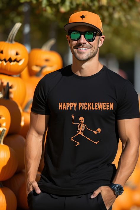 Introducing our Happy Pickleween Pickleball T-Shirt – the ultimate fusion of comfort and style, exclusively designed for pickleball enthusiasts like you. Elevate your pickleball style this Halloween season with the Happy Pickleween Pickleball T-Shirt! It's the perfect Pickleball Halloween costume or a unique Halloween gift for a pickleball enthusiast. Share the fun with fellow players and stand out on the court. Get yours today and serve up style with a touch of humor! Pickleball Halloween Costume, Pickleball Halloween, Pickleball Tournament, Unique Halloween, Tshirt Outfits, Sports Gear, Halloween Season, Halloween Gift, Pickleball