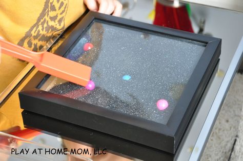 Magnetic Sand Box: shadowbox, black sand, magnetic marbles, magnet wand Magnetic Sand, Box Activities, Diy Magnets, Sand Play, Activities For Children, Preschool Science, Reggio Emilia, Sensory Bins, Sandbox