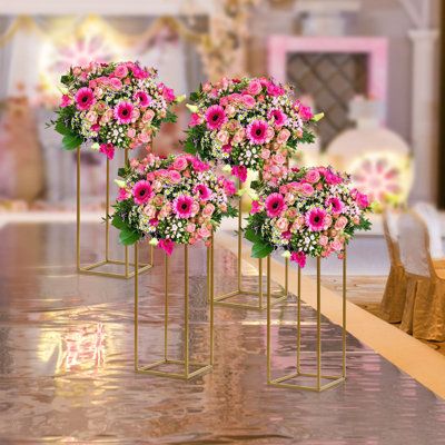 The simple column cube shape makes the flower stand more stable, so you need not worry about it will fall on your important occasions. Place the flower stand to add extra elegance to the party. | Mercer41 Cindel 4Pcs Gold Flower Floor Stand Metal Column Flower Stand Flower Arrangement Metal in Pink / Yellow | 23.6 H x 9.4 W x 9.4 D in | Wayfair Bautizo Ideas Girl, Balloon Birthday Themes, Metal Column, Flower Floor, Stand Flower, Metal Columns, Gala Ideas, Cube Shape, Bloom Baby