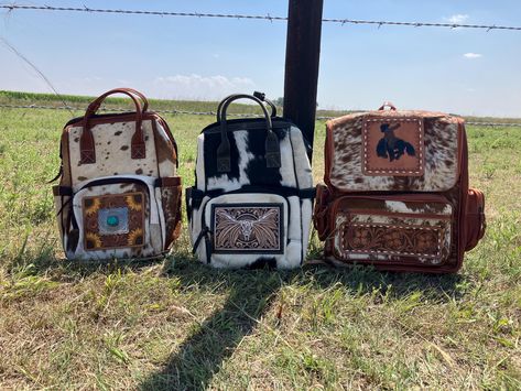 Genuine cowhide and leather on the longhorn, sunflower and bucking horse.  Adjustable shoulder straps.  Many zippered pockets Turquoise and Bucking Horse:  Measures:"16x13x6" Sunflower and Longhorn:  13.5x10x7.5 *Hide pattern will vary Western Diaper Bag, Diper Bags, Western Backpack, Country Accessories, Western Nursery, Tool Backpack, Bucking Horse, Casual Country Outfits, Stanley Cups