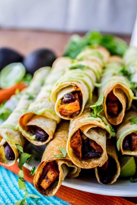 Sweet Potato Taquitos, Potato Taquitos, Vegan Superbowl Food, Black Bean And Sweet Potato, Vegan Super Bowl, Bean And Sweet Potato, Baked Taquitos, Sweet Potato Black Beans, Vegetarian Bake