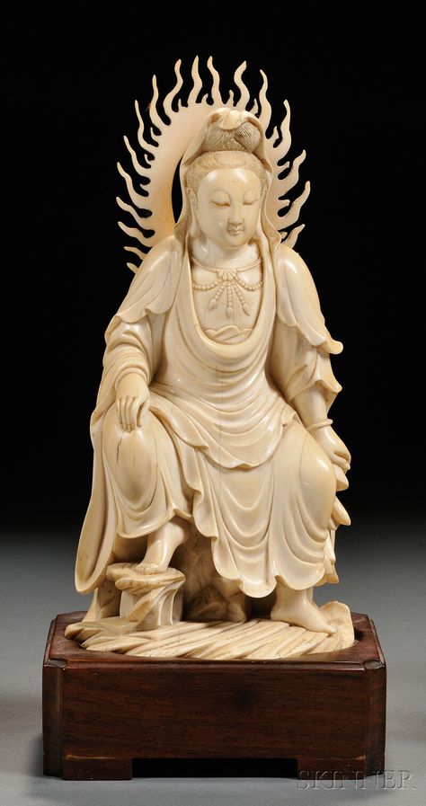 Ivory Carving, China, 19th century, finely carved as the seated figure of Guanyin in the royal ease pose atop rockery, with a flame-shaped aureole to her back, carved Qianlong mark to the base, fitted wood stand, ht. 7 1/2 in. Chinese Antiques, Bone Carving, Buddhist Art, Chinese Culture, Stone Carving, Chinese Art, Namaste, Asian Art, Japanese Art