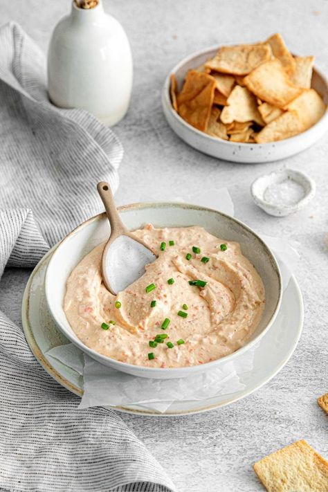 An appetizer bowl with whipped feta dip garnished with fresh green onion. There's a spoon in the bowl for serving. Greek Feta Dip, Holiday Charcuterie Board, Pita Crackers, Cold Dip, Whipped Feta Dip, Cold Dip Recipes, Holiday Charcuterie, Easy Peasy Recipes, Easy Autumn Recipes