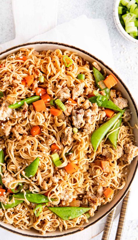 Make this quick and easy chicken noodle stir fry for a delicious, better-than-takeout meal at home! Made with ground chicken, fresh veggies, and a savory soy glaze, this dish is perfect for busy weeknights. It's budget-friendly, customizable, and will become a requested family favorite. Try it tonight and enjoy a tasty, homemade fakeaway dinner that's ready in just about 20 minutes! #stirfry #ramen #easyrecipes #weeknightdinner #homemadecooking #fakeaway #takeout Easy Chicken Ramen Stir Fry, Ground Chicken Ramen Stir Fry, Ground Chicken Ramen Noodle Recipes, Ground Chicken Ramen, Best Ramen Recipe, Chicken Noodle Stir Fry, Stir Fry With Noodles, Egg Recipes For Lunch, Chicken Ramen Noodle Recipes