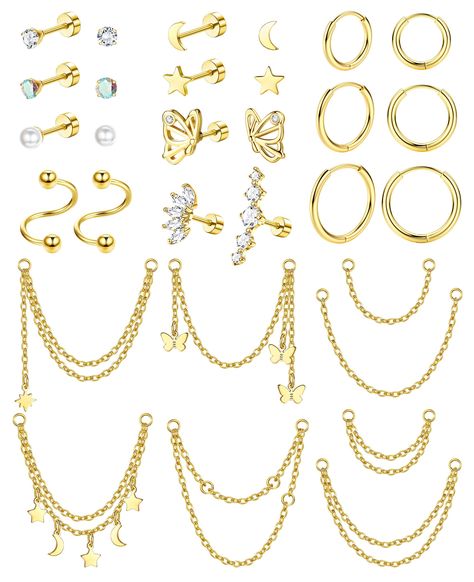 PRICES MAY VARY. ✨VARIOUS STYLES✨Comes with 16Pcs Cartilage Stud Earrings and 6Pcs Small Huggie Hoop Earring and 8Pcs Chain Dangle Piercing. Chain Dangle Design and Various Kinds of Cartilage Piercing Jewelry Provide Different Collocation, Satisfy Your Changeful Demands, Just Enjoy the Fun of DIY. ✨HYPOALLERGENIC MATERIAL✨Made of High-Quality Stainless Steel, Nickel/Lead Free, Hypoallergenic Flat Back Earrings for Sensitive Ears. Can Be Used As Cartilage Piercing Jewelry, Helix Piercing Jewelry, Earrings For Helix Piercing, Helix Chain Earrings, Helix Piercing Chain, Cartilage Stud Earrings, Piercing Chain, Conch Ring, Moon Butterfly, Tragus Piercing Jewelry, Helix Piercing Jewelry