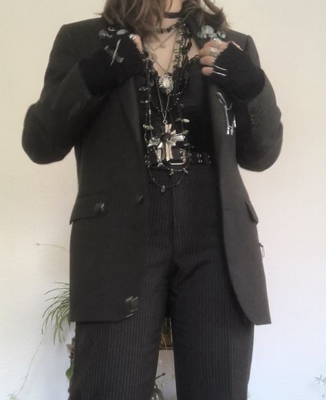 A mid-sized person/girl grey/dark green striped suit decorated with lots of oins and chains, black arm warmers, black platform dr. Martens and multiple crystal rings and bracelets. 		The person is also wearing multiple silver necklaces, a big one in form of a cross. Alt Formal Wear, Formal Alternative Outfit, Alt Formal Outfits, Corset Suit Outfit, Alt Suit, Grunge Suit, Crowcore Fashion, Goth Suit, Formal Punk