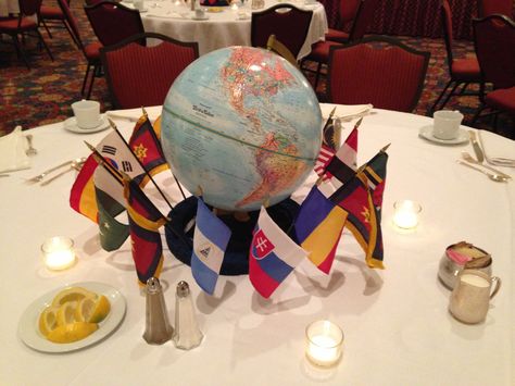 Globe with international flags. Flags are stuck in Styrofoam ring that has been painted blue. Decorations for" Christ for the whole wide world" dinner (or any international themed program). International Party Decorations, International Party Theme, International Decor, Dinner Party Ideas, Around The World Theme, International Party, Prom Themes, Travel Party Theme, Dinner Party Invitations