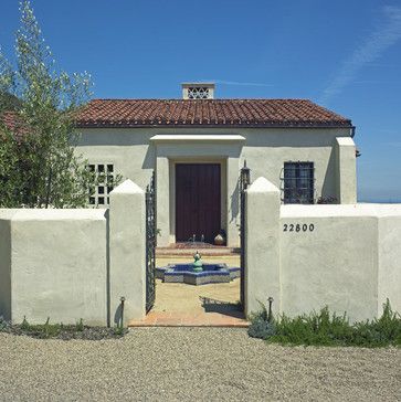 Rendered Fence, Small Spanish Style Homes, Courtyard Inspiration, White Stucco Exterior, Exterior Render, Stucco Colors, Entry Door Designs, Mediterranean Exterior, Spanish Bungalow