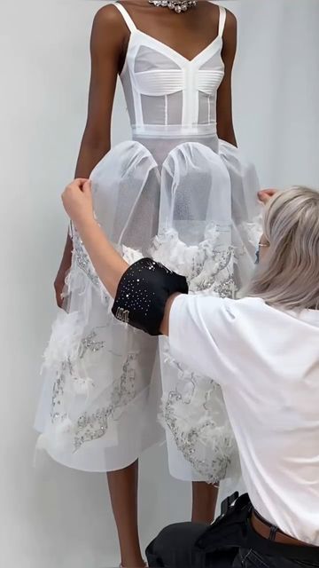 Haute Couture with CoutureNotebook on Instagram: "Captured inside the @alexandermcqueen Atelier circa 2022: the making of the skeletal corset dress with an arched skirt, crystal raindrop and shredded tulle cloud embroidery in blush pink silk, mesh and Paris net.  What do you think? 📷 @alexandermcqueen" Cloud Embroidery, Puffy Dresses, Mesh Corset, Skeletal, Pink Silk, Corset Dress, Blush Pink, Alexander Mcqueen, You Think