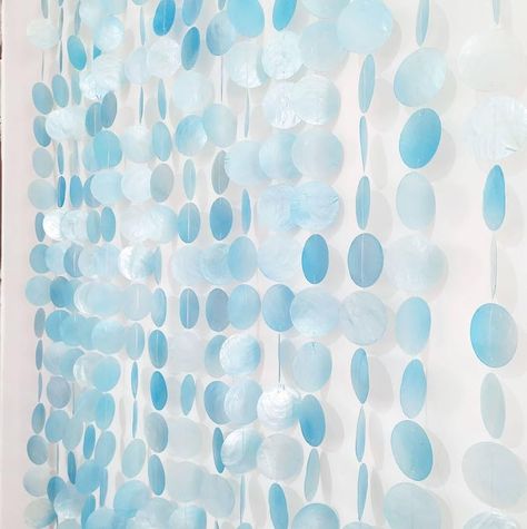 PRICES MAY VARY. CAPIZ CUTAIN WHITE BLUE BEADED DOORWAY STRING CURTAIN (10 Strands) This classic doorway curtain is made of natural capiz shell with 2"/5cm of diameter. It is a perfect decoration for your doorways, room divider, wedding event decoration, or wall decoration Its natural color blends nicely with any room style you have, whether it is a boho, a scandinavian, or even a farmhouse. It will bring in that summer vibes into your house. Moreover, the sound of these shells is so relaxing! E Room Divider Wedding, Shell Curtain, Shell Wall Art, Shell Garland, Donor Wall, String Curtains, Themed Rooms, Doorway Curtain, Ocean Nursery