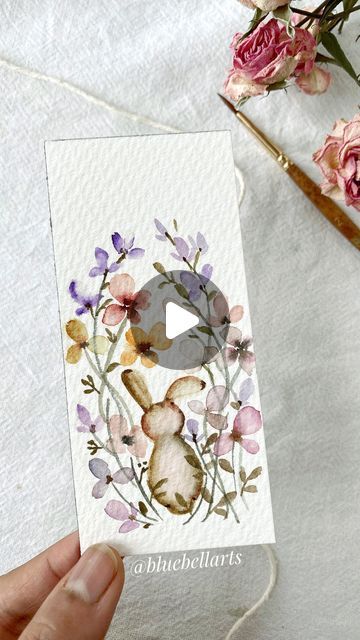 Bluebellarts by Padmini on Instagram: "Colourful flowers and Easter bunny…with watercolour… fun and easy to paint! 🌼🌱💖  Painted with watercolour @winsorandnewton  Brush @princetonbrush round size 2 Cold pressed 300gsm watercolour @archespapers   #greetingcards  #watercolorillustration #watercolorpainting #watercolorvideotutorial  #flowerbouquet #mutedandmoody  #colourfulflowers #floralpattern #flowerdesign  #artdaily #artreels #reelitfeelit  #transition #instareels #paintings #watercolorartefact #watercolorbookmarks #watercolorflowers #astheticart #artasthetics #botanicalart #illustrationnow #watercolor_guide #nofilter #paintingprocess #paintingreels #wildflowerwatercolor #watercolorartist #instareels #floralartist #illustrationnow #modernflorals" How To Paint A Bunny, Water Colour Painting Watercolour Easy, Watercolour Bunnies, Watercolor Guide, Paint Tutorials, Easy To Paint, Bunny Watercolor, Painting Spring, Colourful Flowers