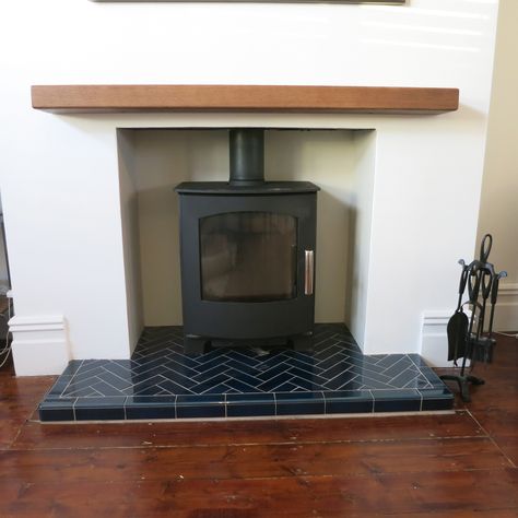 Stunning Mendip Churchill multi fuel stove with a blue herringbone tiled hearth Stove Fireplace Tiles, Fireplace With Tiled Hearth, Tiled Fireplace Herringbone, Woodburner Tiles Ideas, Tiling Fireplace Hearth, Fire Hearth Tiles, Wood Burner Hearth Ideas, Log Burner Hearth, Tile Hearth Wood Stove