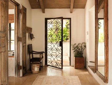 60 Spanish-Style Foyer Ideas (Photos) Spanish Wrought Iron, Exterior Paint Colours, Iron Ideas, Arch Entryway, Dark Wooden Floor, Wooden Double Doors, Traditional Armchairs, Foyer Ideas, Wooden Main Door