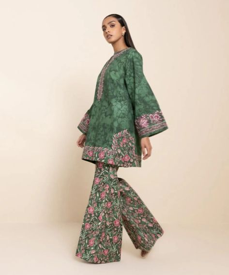 Collection - Sapphire Collection Nail the trendy winter look with our green and multicoloured cross hatch two-piece featuring an embroidered shirt and trousers. Shirt: Printed Cross Hatch Shirt 3M Embroidered Hem & Sleeves Border 2PC Embroidered Neckline 1PC Fabric: Cross Hatch Colour: Green Trousers: Printed Cross Hatch Trouser 2.5M Fabric: Cross Hatch Colour: Multicolor Launching soon. Stay tuned for more updates Pakistani Two Piece Dress, Cotton Suit Designs, Fabric Cross, Embroidered Hem, Pakistani Fancy Dresses, Beautiful Pakistani Dresses, Green Trousers, Indian Prints, Pakistani Dress