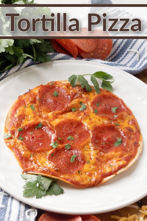 Tortilla Pizzas make a quick and easy meal idea. Use your favorite toppings for the perfect for lunch, dinner, game day grub, or delicious snack any time! #pizza #lunch #dinner #snack #gameday #easyrecipe #backtoschool Cooking With Tortillas, Pizza Made With Tortilla Shells, Pizza On Tortilla Shells, Tortilla Pizza Recipes, Shell Recipes, Recipe Tortilla, Tortilla Pizzas, Pizza Lunch, Baked Recipes